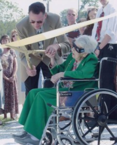 Ms. Bessie Ward cutting the ribbon for ground breaking at Fletcher First Baptist Church